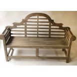 GARDEN BENCH, weathered solid teak with raised slatted back after a design by Sir Edwin Lutyens,