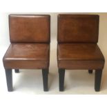 COCKTAIL CHAIRS, a pair, 1970's restored tan leather with tapering supports, 47cm W.