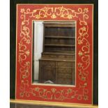 WALL MIRROR, contemporary, with central bevelled plate within a red and gold hand painted frame,