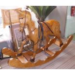 IAN ARMSTRONG ROCKING HORSE, 20th Century laminate, ply construction, bears plaque to base,