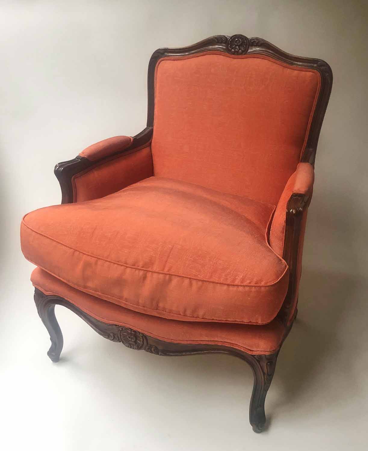 BERGERE, Louis XV style carved mahogany with noiré silk upholstery and cabriole front supports,