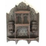 INDIAN WALL SHELF, carved hardwood with canopies, turrets and pierced tracery, 76cm H x 62cm.