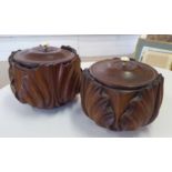 TOBACCO POTS, a pair, 19th century, turned and carved mahogany, 12cm H.