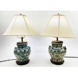 TABLE LAMPS, a pair, Chinese blue and white vase form with hardwood bases and linen shades, 45cm H.