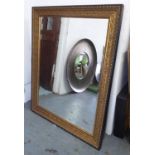 WALL MIRROR, continental style bevelled plate with gilt frame with ebonised detail, 143cm x 113cm.