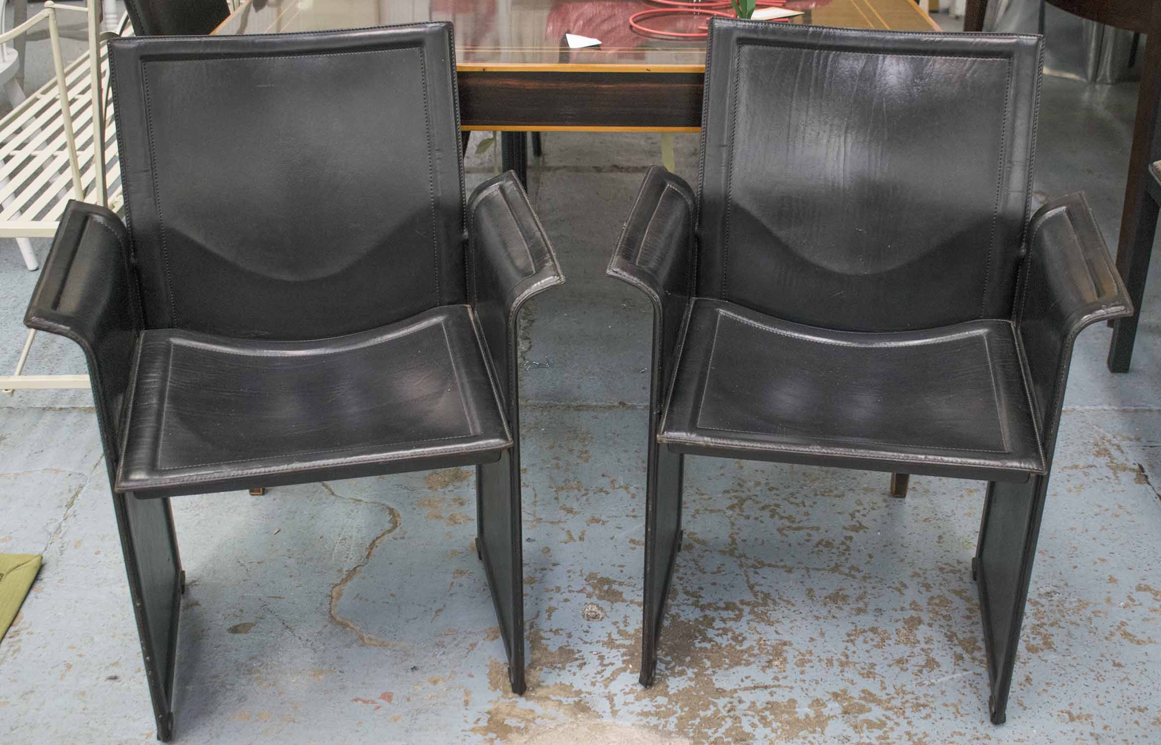 MATTEO GRASSI KORIUM ARMCHAIRS, a set of four by Tito Agnoli, in stitched black leather, 63cm W.