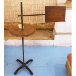 READING STAND, late Victorian birch with adjustable rest and circular tier on cast iron base,