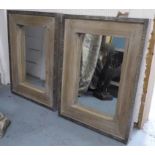 WALL MIRRORS, a pair, rectangular hardwood, metal bound and brass studded, 100cm x 75cm.