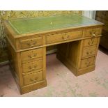 PEDESTAL DESK, late Victorian oak with tooled green leather top over an arrangement of nine drawers,