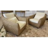 WICKER CONSERVATORY ARMCHAIRS, a pair, with cushions, 75cm H x 85cm x 85cm.