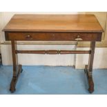 WRITING TABLE, early Victorian mahogany with frieze drawer on end standards and castors,