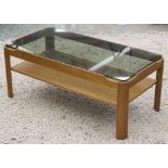 MYER LOW TABLE, 1970's teak with undertier and rounded rectangular sepia glass top,