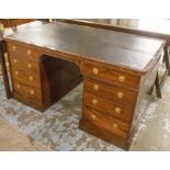 VICTORIAN LIBRARY DESK, mahogany with a lined top above an arched centre and eight drawers,