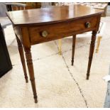 BOWFRONT WRITING TABLE, Regency mahogany with a single frieze drawer on ring turned supports,