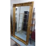 WALL MIRROR, in the continental style, gilt finish, 209cm x 115cm.