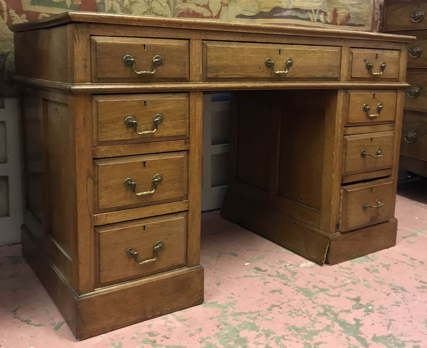 PEDESTAL DESK, late Victorian oak with tooled green leather top over an arrangement of nine drawers, - Image 2 of 3