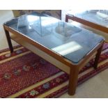 MYER LOW TABLE, 1970's teak with under tier and rounded sepia glass top, 36cm H x 87cm x 44cm.