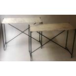CONSOLE TABLES, a pair, with rectangular veined white marble tops and black x stretcher supports,