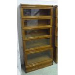 GLOBE WERNICKE BOOKCASE, early 20th century five tier oak with rising glazed fronted compartments,