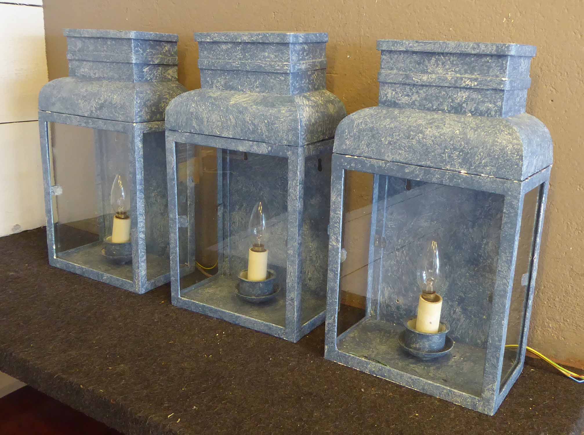 ATTRIBUTED TO TINDLE WALL LANTERNS, a set of three, 23cm x 13cm x 42cm approx.