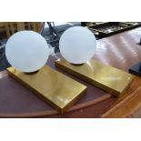 TABLE LAMPS, a pair, Hollywood Regency style, brass with opaque glass shades, 18cm H.