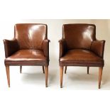 BRIDGE ARMCHAIRS, a pair, 1950's hand dyed piped mid brown hide leather with bowed backs,