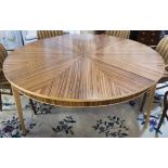 DINING TABLE, French Art Deco style, zebrawood with circular segmented top, 76cm H x 168cm.