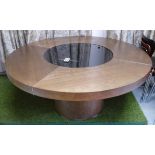 DINING TABLE, walnut, the circular top on a central column with a smoked glass lazy susan,