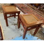 CHINESE STOOLS, a pair, early 20th century, elm with caned tops on red lacquered bases,