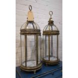 LANTERNS, a pair, French style gilt metal with glass panels, 78cm x 26cm.