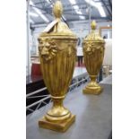 DECORATIVE URNS, a pair, Hollywood Regency style, gilt finish, 88cm H approx.