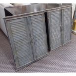 MIRRORS, a pair, distressed metal with louvered shutters, 72cm H x 58cm.