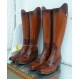 UMBRELLA STANDS, a pair, faux riders boots form, 48cm H.