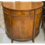 DEMI LUNE SIDE CABINET, Georgian style mahogany, with single drawer above a door,