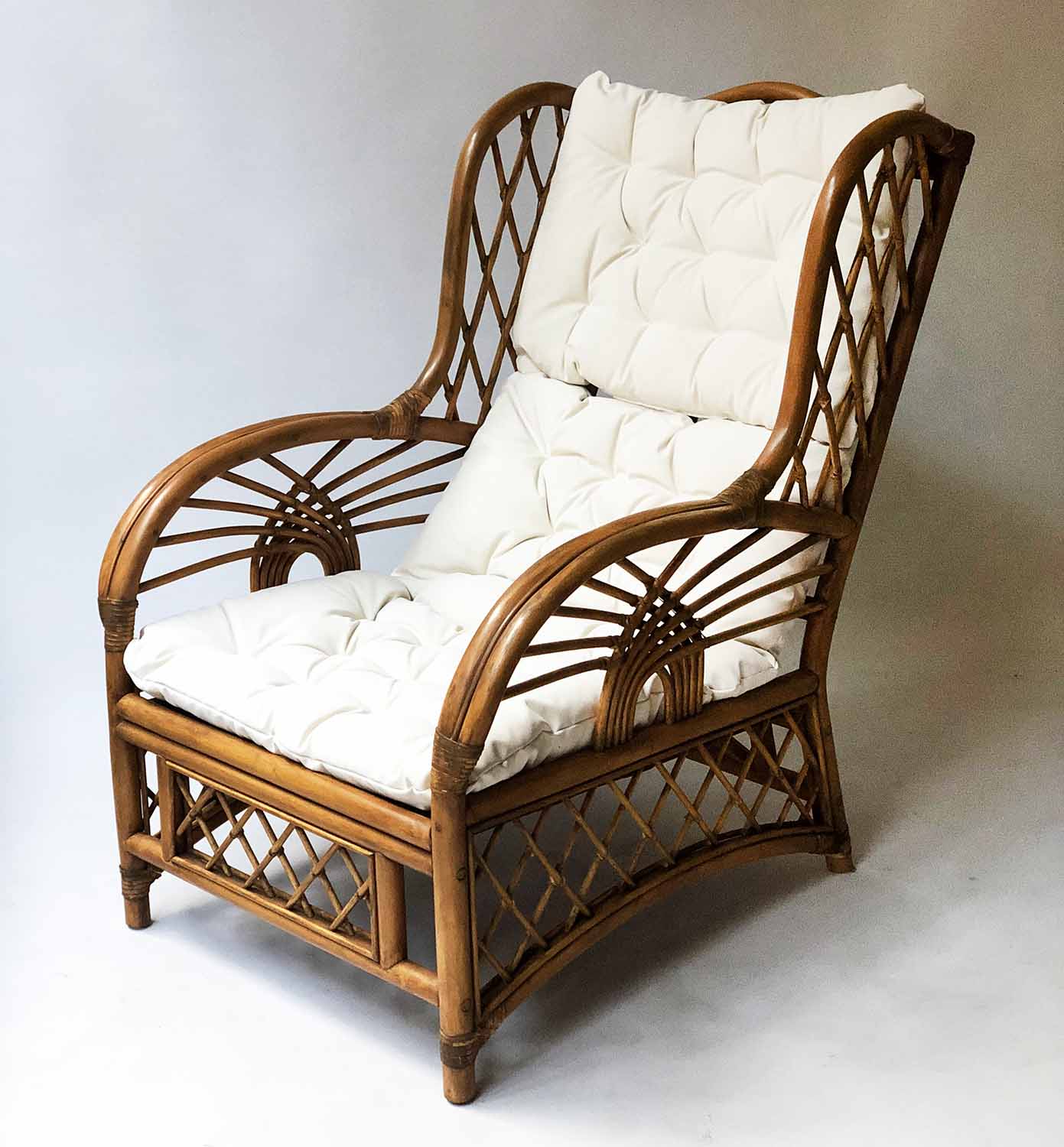 RATTAN ARMCHAIR, vintage 1930's inspired bent and woven rattan with cushion pads, 67cm W.
