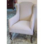 WING ARMCHAIR, Edwardian in ticking upholstery on castors, 63cm W.