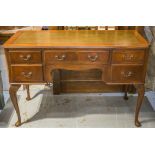 WRITING TABLE, Queen Anne style walnut with green leather top above five drawers,