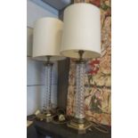 LAMPS, a pair, with twisted glass columns and brass bases, 44cm H.