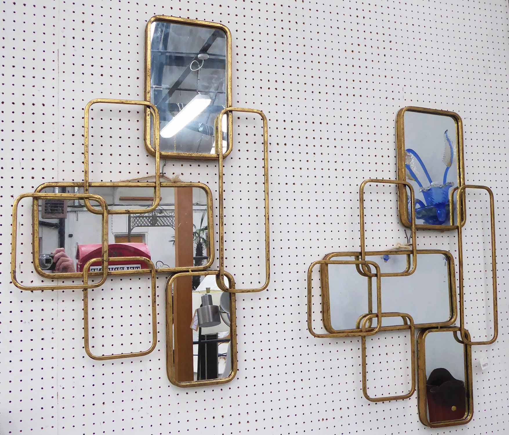 WALL MIRRORS, a pair, 1960's French style segmented design, 81cm x 53cm.