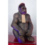 CONTEMPORARY SCHOOL, the gorilla with baseball cap, faux bronzed finish, 60cm H.