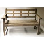 GARDEN BENCH, silvery weathered teak, Glasgow School, slatted with broad arms,