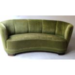 ART DECO STYLE SOFA, of curved form with green velvet corded upholstery, 176cm W.