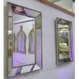 WALL MIRRORS, a pair, antiqued mirrored frame with silvered beaded detail, 91cm x 61cm.