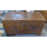 TRUNK, Chinese carved camphorwood depicting traditional scenes with a rising lid,