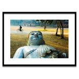 STEVE McCURRY 'A Man Rides Past a Buddha Statue in a Park in Mandalay - Burma', lithograph,