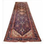 ANTIQUE NORTH WEST PERSIAN CORRIDOR CARPET, 490cm x 145cm.