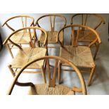 AFTER HANS J WEGNER WISHBONE STYLE DINING CHAIRS, a set of six, with paper cord woven seats, 78cm H.