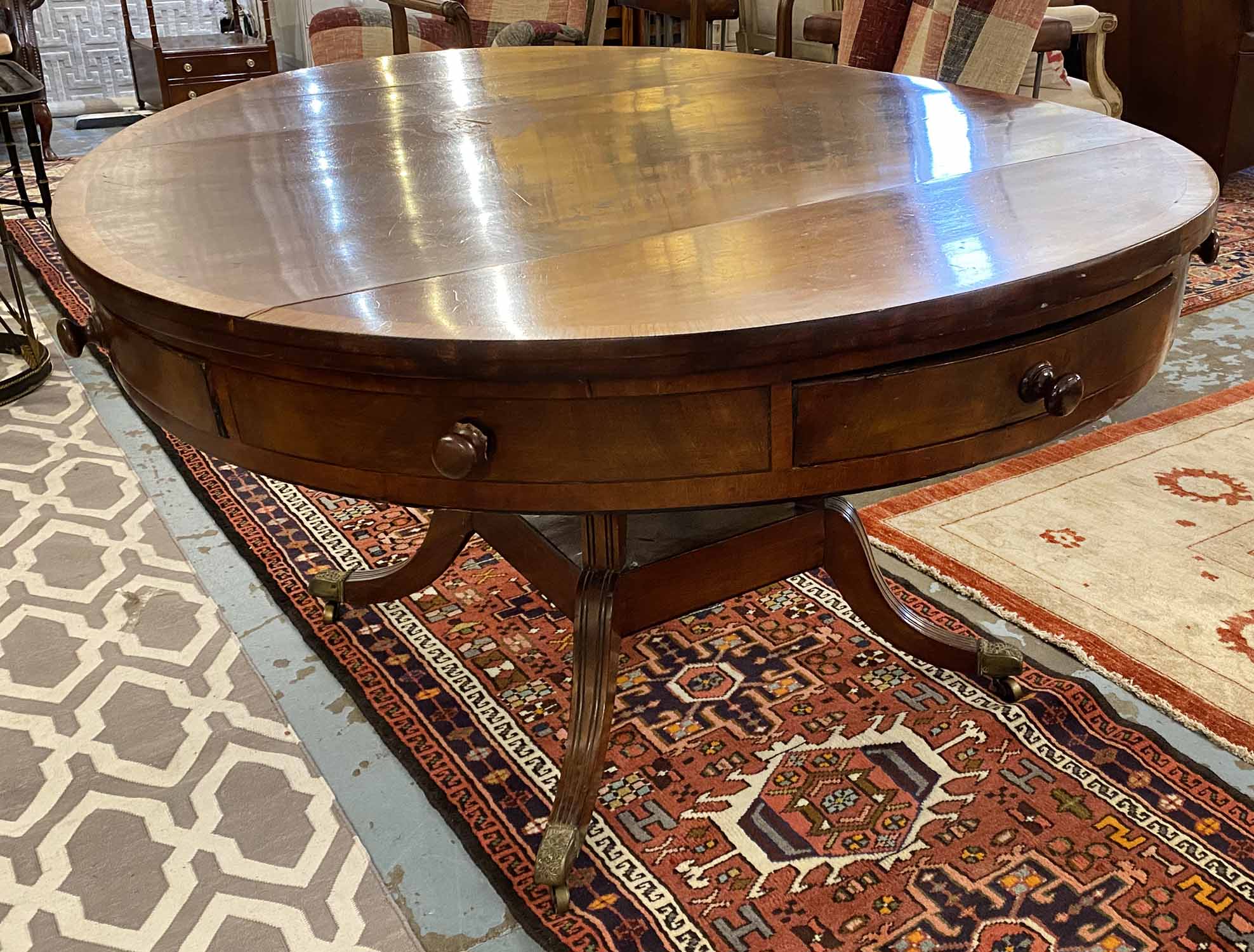 DRUM TABLE, Regency mahogany with circular crossbanded top above four real and four dummy drawers,