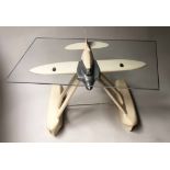 SEAPLANE LOW TABLE, rounded rectangular glass with model aeroplane, 92cm x 61cm x 42cm H.