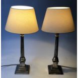 TABLE LAMPS, a pair, silvered Corinthian capped reeded columns with stepped plinths, 70cm H.